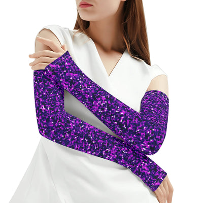 Person wearing a white outfit with a purple glittery arm sleeve on a white background