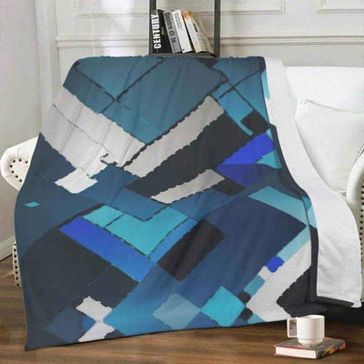 Blue Geometric Fleece Throw Blanket - On white couch | Our Phoenix Rise