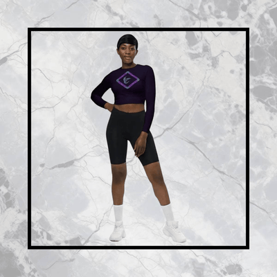 Soaring Bird Cropped Rash Guard Women's UPF 50+ - Woman posing in deep violet cropped rash guard with bird logo | Our Phoenix Rise