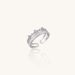 Adjustable gold-plated crown ring with zirconia crystals in ornate tiara design on white background.