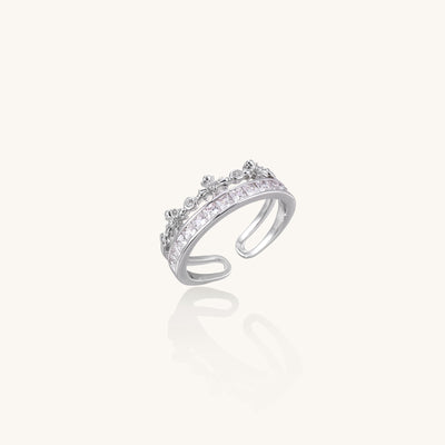 Adjustable gold-plated crown ring with zirconia crystals in ornate tiara design on white background.