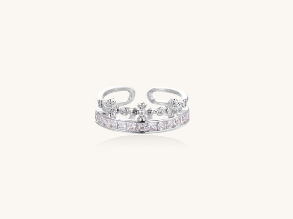 Adjustable gold-plated crown ring with zirconia crystals in ornate tiara design on white background.