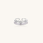 Adjustable gold-plated crown ring with zirconia crystals in ornate tiara design on white background.