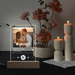 Personalized Music Player Acrylic Plaque - Custom photo and song details illuminated by LED base, with candles and flowers in | Our Phoenix Rise