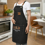 Personalized Dad Fixer Apron - black, worn by person in kitchen, full view | Our Phoenix Rise