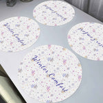 Winter Comfort Snowflake Round Placemats - group of four showing text and pattern | Our Phoenix Rise