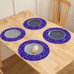 Personalized Blue Snowflake Round Placemats - Overhead view on wooden table with plates | Our Phoenix Rise