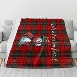 Plaid Snowman Winter Flannel Blanket - Draped on a white sofa with vertical text | Our Phoenix Rise