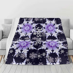 Personalized Snowflake Flannel Blanket - Close up on sofa showing snowflake pattern and custom name Jasmine | Our Phoenix Rise