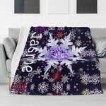 Personalized Snowflake Flannel Blanket - Draped over white sofa with custom name | Our Phoenix Rise