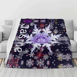 Personalized Snowflake Flannel Blanket - Close view on sofa with custom name "Jasmine" | Our Phoenix Rise
