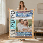 Smiling woman displaying personalized couple photo blanket with custom photo and love messages | Our Phoenix Rise