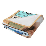 Personalized couple photo blanket folded on a bed, highlighting custom image and text | Our Phoenix Rise