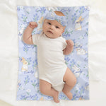 Personalized Baby Bunny Blanket Beanie Set - Baby on blue blanket with white bunnies and flowers | Our Phoenix Rise