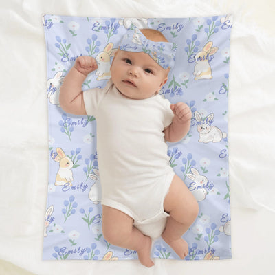 Personalized Baby Bunny Blanket Beanie Set - Baby on blue blanket with white bunnies and flowers | Our Phoenix Rise