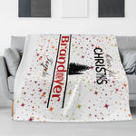 Personalized Our First Christmas Flannel Blanket - Draped over a couch with Christmas trees and stars | Our Phoenix Rise
