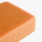 Kojic Acid Turmeric Soap - top down view, bar unwrapped | Our Phoenix Rise