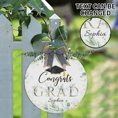 Personalized Graduation Welcome Sign Round Door Hanger - displayed on white picket fence with greenery | Our Phoenix Rise