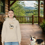 Corgi Love Graphic Hoodie - Sand with Woman and Corgi in Cabin | Our Phoenix Rise