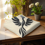 Phoenix Silhouette Woven Blanket - folded on a couch armrest | Our Phoenix Rise