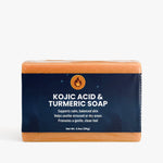 Bar of Kojic Acid & Turmeric Soap with blue and orange packaging on a white background