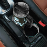 Black mug with a cartoon character in a car cup holder