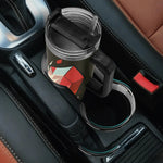Black mug with geometric design in a car cup holder