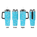 Blue tumbler with snowflake pattern from different angles on a white background