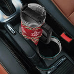  Christmas-themed cup holder with a red and green plaid design in a car.