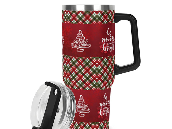 Christmas-themed travel mug with plaid pattern and text on a white background