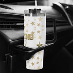 Clear mug with star patterns on a car cup holder