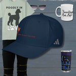 Collection of items including a t-shirt, cap, mug, and cup on a wooden surface.