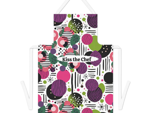 Colorful apron with geometric pattern and 'Kiss the Chef' text on a white background
