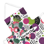 Colorful apron with geometric pattern and 'Kiss the Chef' text on a white background