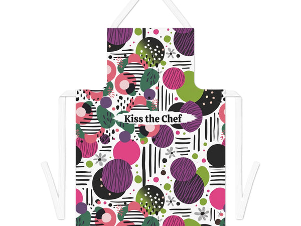 Colorful apron with geometric pattern and 'Kiss the Chef' text on a white background