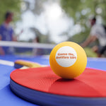 Funny Beer Pong Balls Set - Orange balls scattered on wooden floor | Our Phoenix Rise