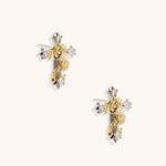 Gold cross earrings featuring sculpted rose flowers and cubic zirconia crystals. Ornate vintage style fashion jewelry.