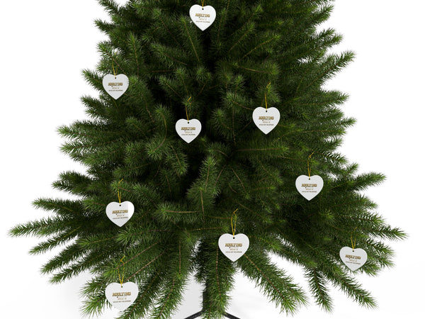 Green Christmas tree with heart-shaped white ornaments on a white background