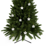 Green Christmas tree with star-shaped white ornaments on a white background