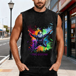 Man wearing a black sleeveless shirt with colorful graphic design on a city street.