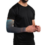 Person wearing a black t-shirt with a galaxy-themed arm sleeve on a white background