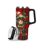 Travel mug with Christmas elf design on a red plaid pattern