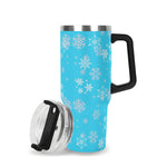 Travel mug with snowflake pattern on a blue background