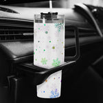 Tumbler with snowflake design on a car cup holder
