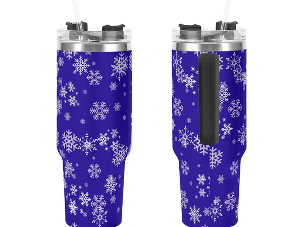 Two blue tumblers with white snowflake patterns on a white background