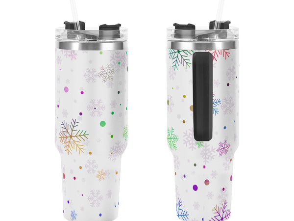 Two insulated tumblers with snowflake and polka dot pattern on a white background