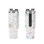 Two insulated tumblers with snowflake and polka dot pattern on a white background