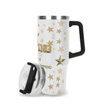White travel mug with gold stars and text on a white background