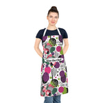 Woman wearing a colorful apron with geometric pattern and 'Kiss the Chef' text on a white background