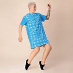 Blue Snowflake T-Shirt Dress - Woman with short blonde hair dancing joyfully | Our Phoenix Rise